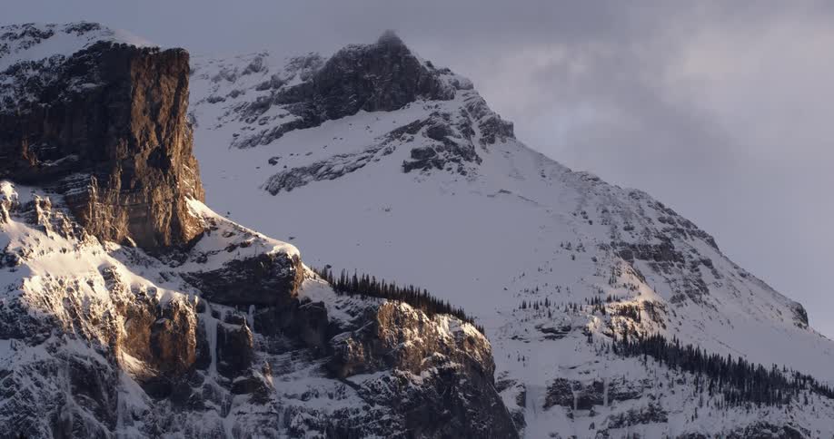 Snow-covered mountainous area on a cloudy day