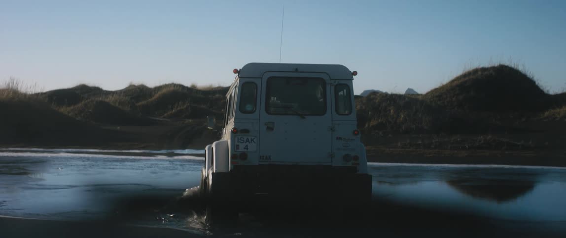 A vehicle crossing over a river
