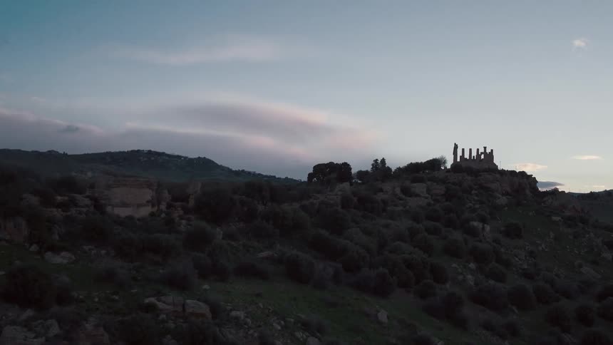 A ruined building on a hill