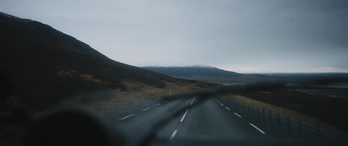 Car is driving on a road in a rural area