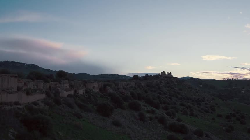 The sun sets over a rural area