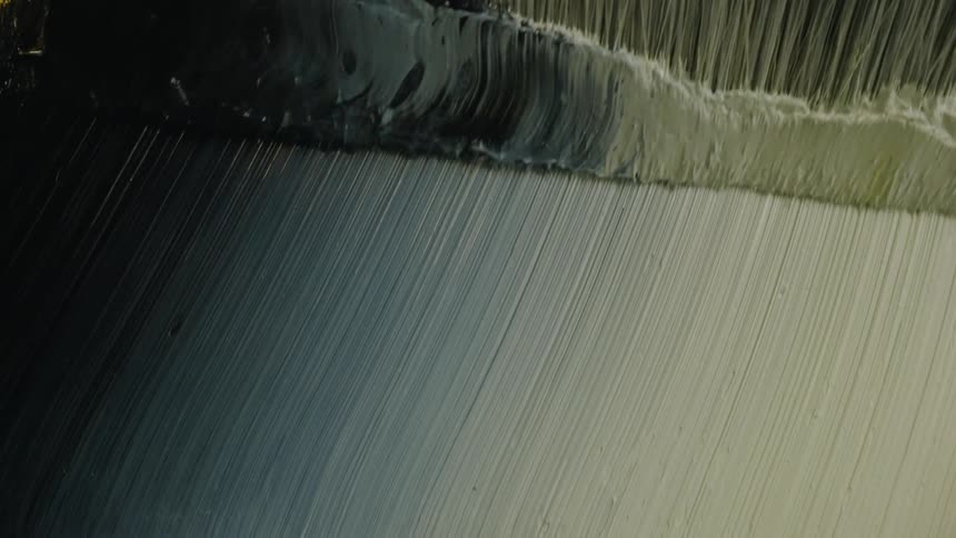 Close up of a paint brush spreading paint