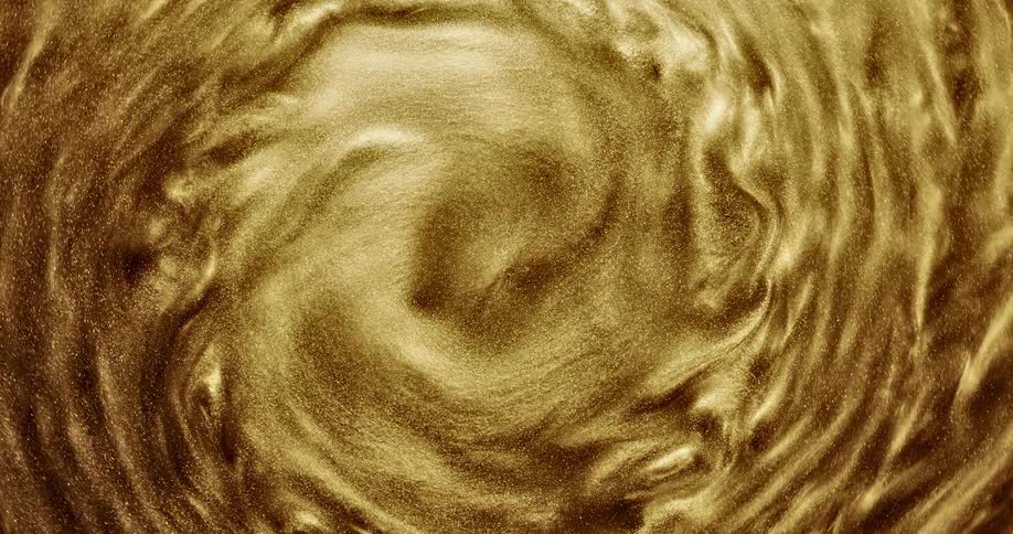 A golden portal shines as it turns and rotates