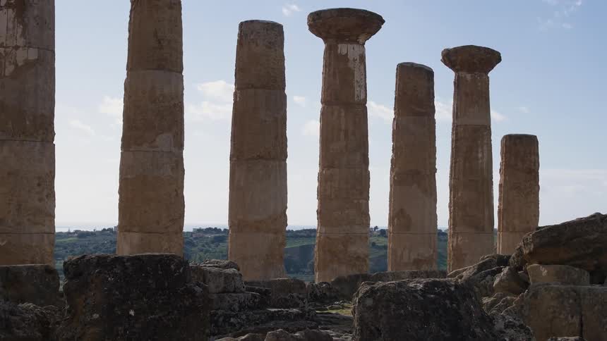 Weathered stone pillars on a clear day