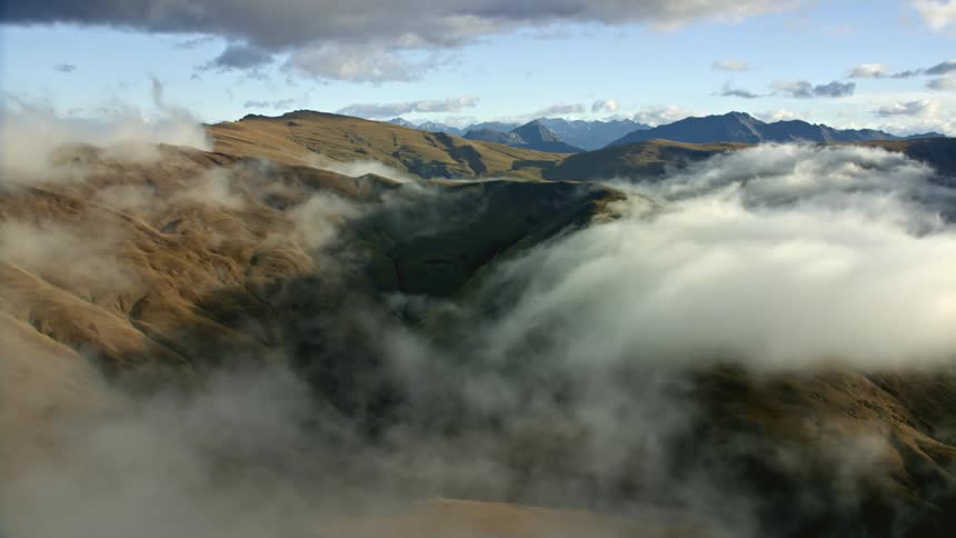 Clouds moving over a mountain range