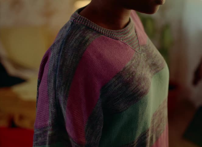There is a young teenager girl inside of her bedroom