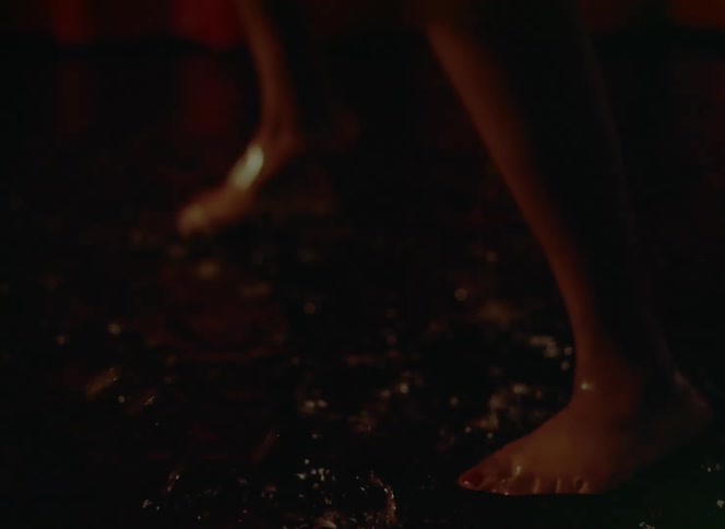 A person is dancing in a puddle