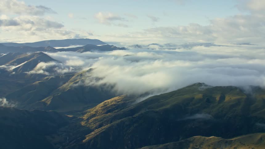 Heavy fog settles over a mountain range