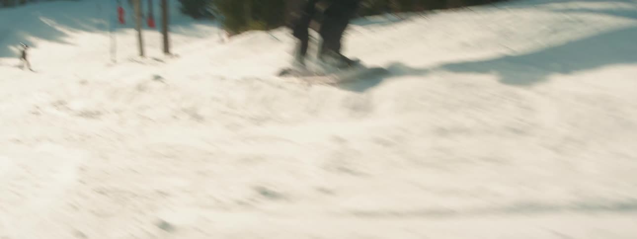 A view of a person snowboarding outdoors