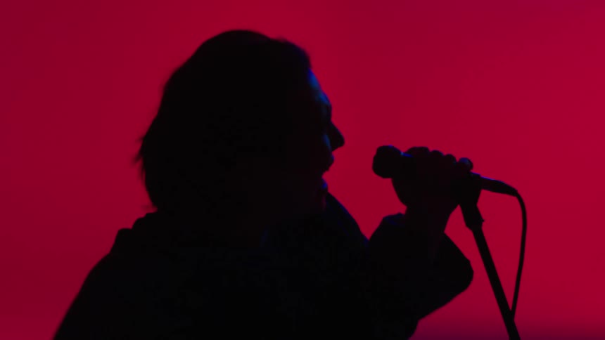 A man singing on stage