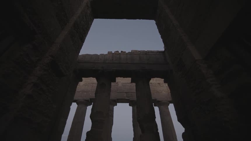 Stone pillars tower overhead