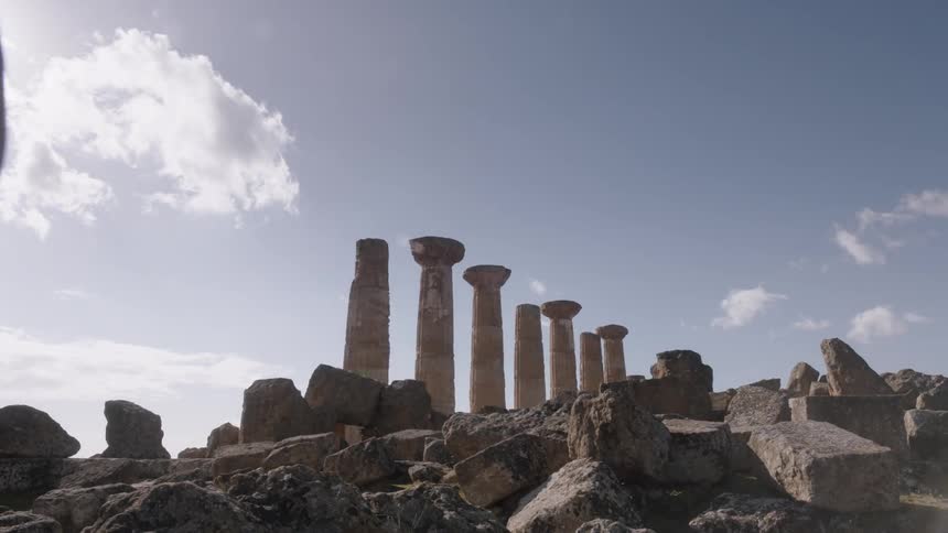 Ancient pillars on a partly cloudy day