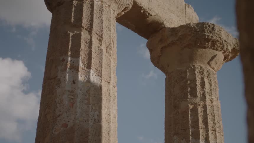 Weathered stone pillars during the day
