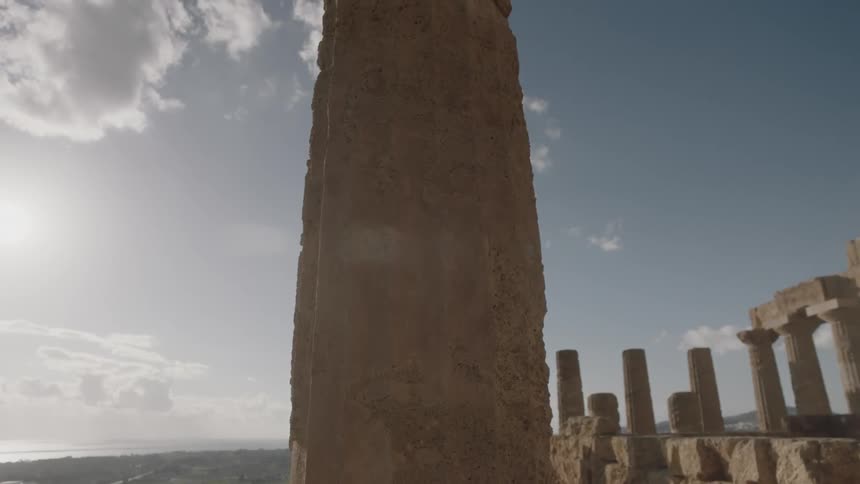 An old stone pillar towers overhead