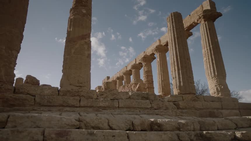 Stone pillars and ruins tower overhead