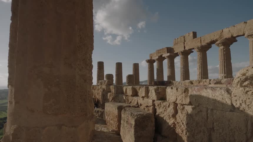 Ancient ruins on a partly cloudy day
