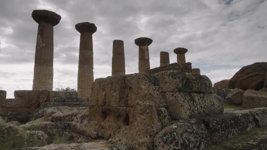 Weathered stone pillars on a cloudy day