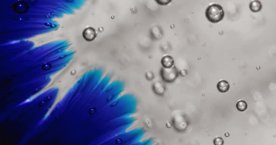 Bubble spheres move across a blue and white organic environment
