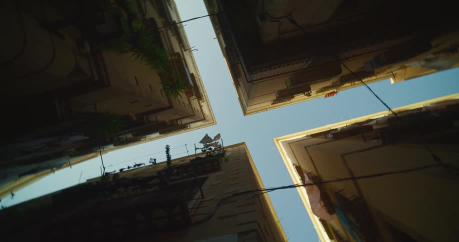 Looking up at Gothic Quarter narrow buildings