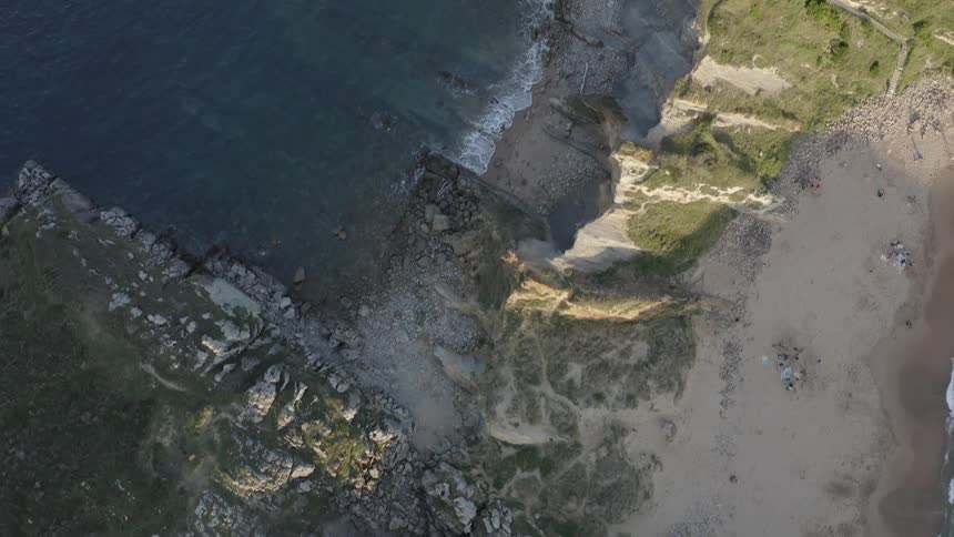 Waves crash against the mountainous Cantabrian shore
