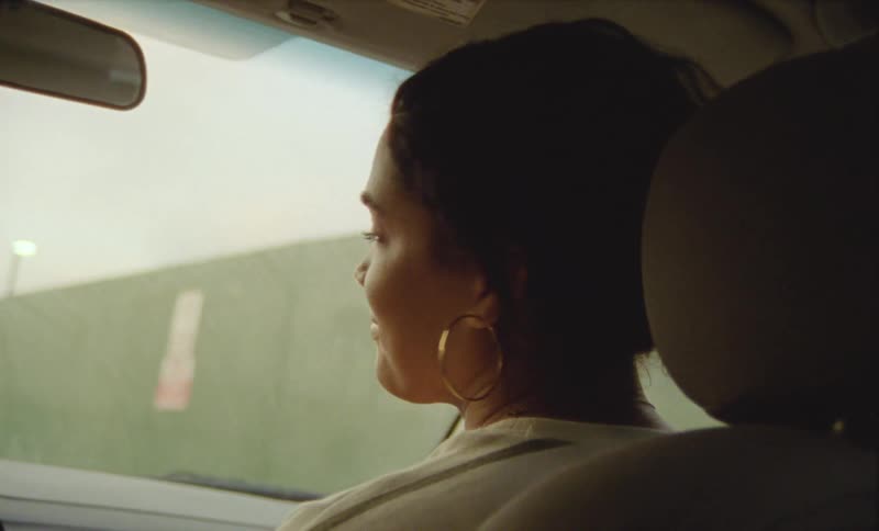 A woman riding in a car