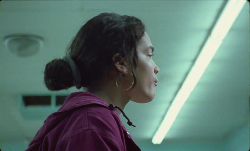 Side profile of woman drinking from can of coca cola