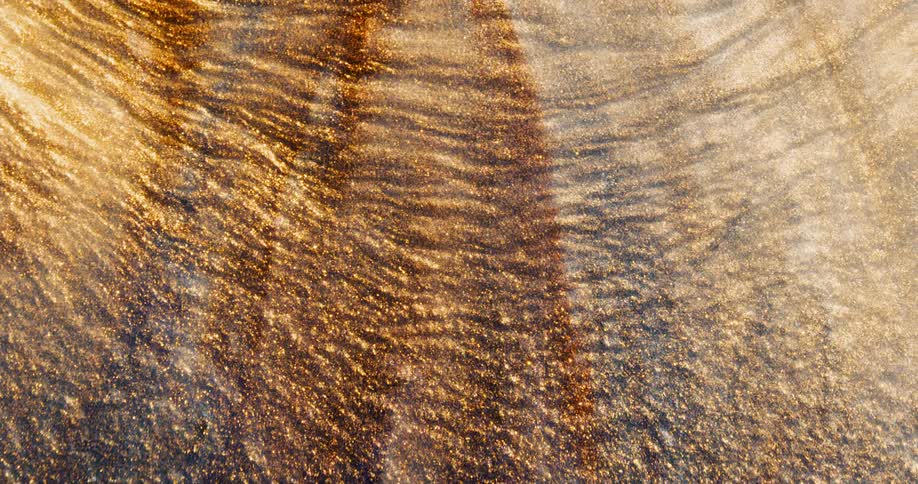 Grains of sand flowing down