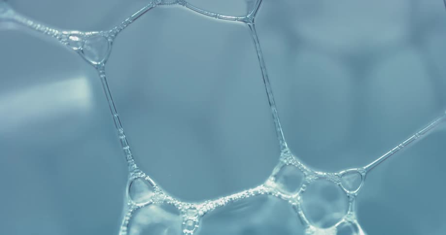 A bubble substance reflects as it moves and the sections of bubbles grow and spread