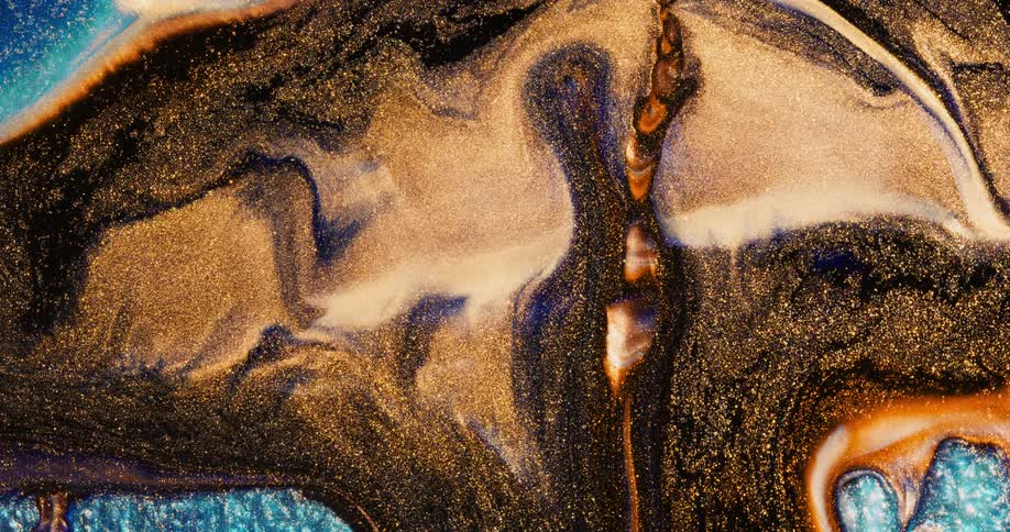 A sparkling and moving gold and bronze area is alive in a blue space and blends into the environment