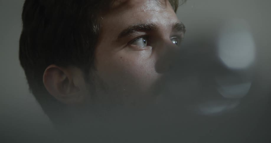 A man looks around nervously
