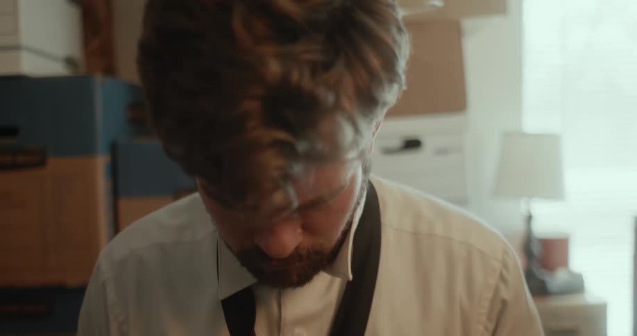 Man with beard wears tie