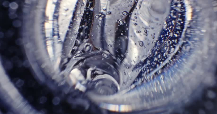 Flowing and bubbling clear liquid