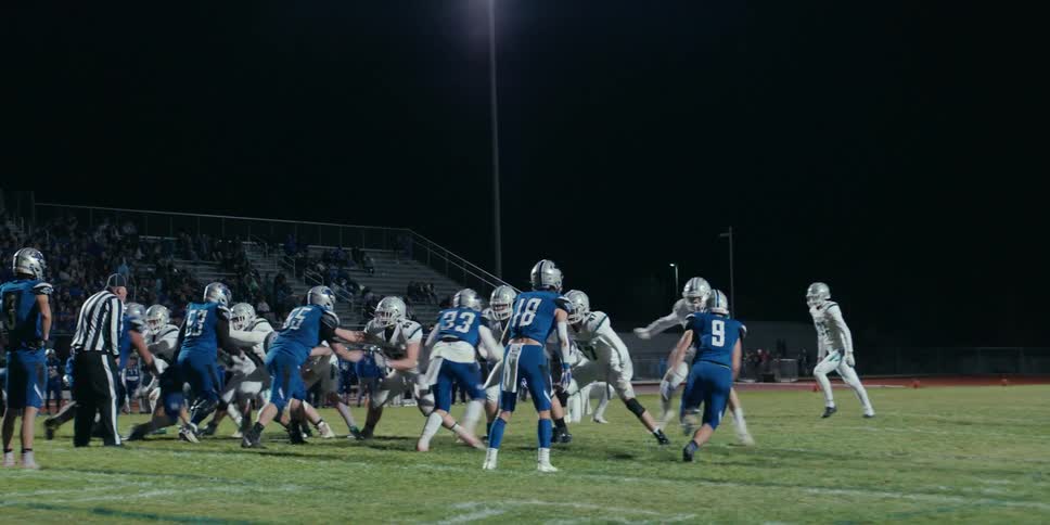 A football player kicks a field goal during a game
