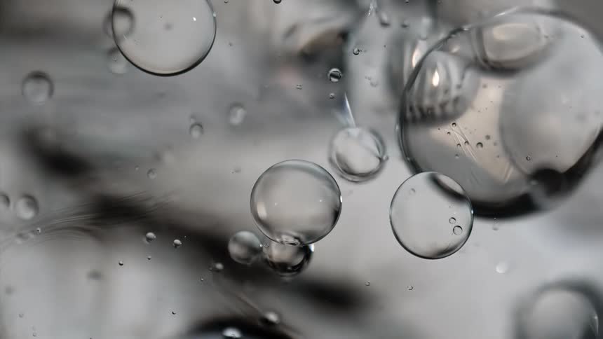 Bubbles and spheres reflect light as they float and move