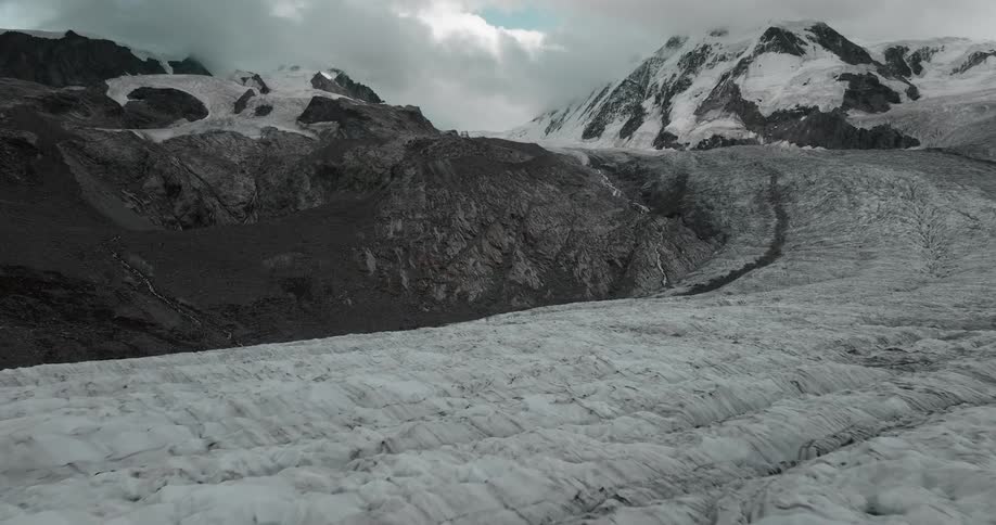 A snowy mountain landscape on a cloudy winter day