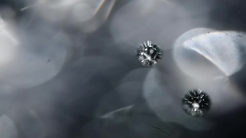 Small bubbles move around in the water