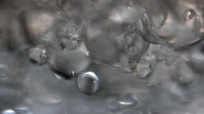 Large air bubbles form at the surface of a viscous liquid