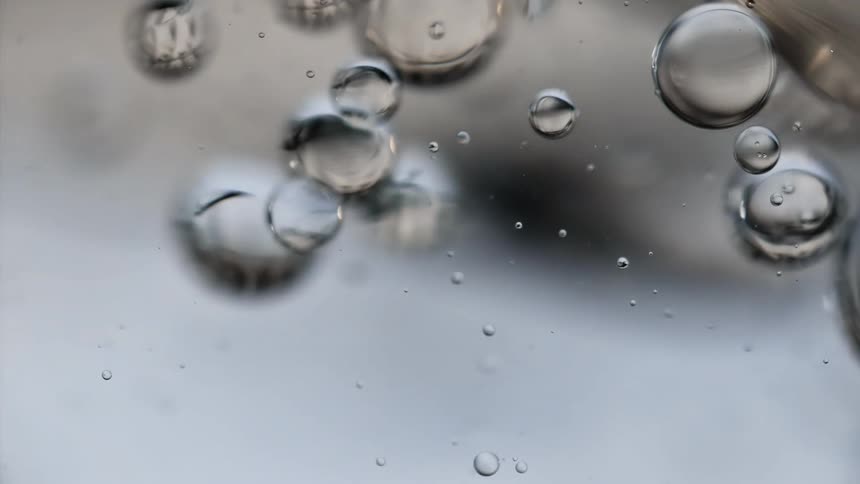 Droplets floating in clear liquid