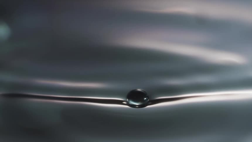 A view of a water drop making a ripple