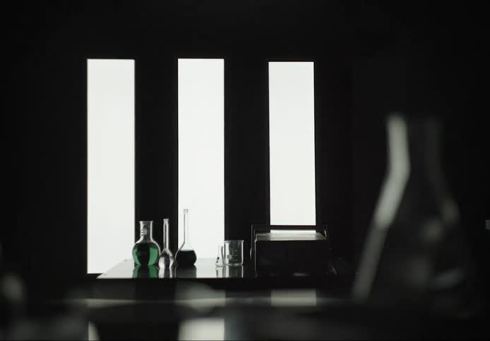 Lights turn on showing lab with chemicals