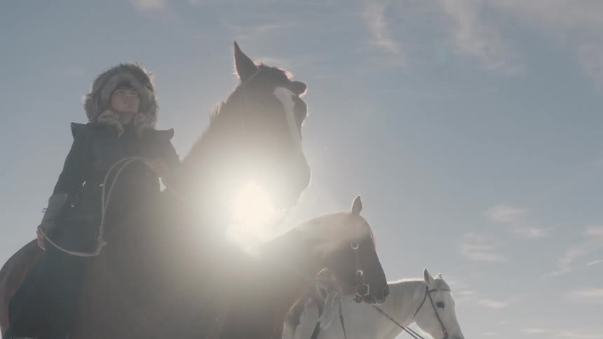 Explorers on horses in a cold climate