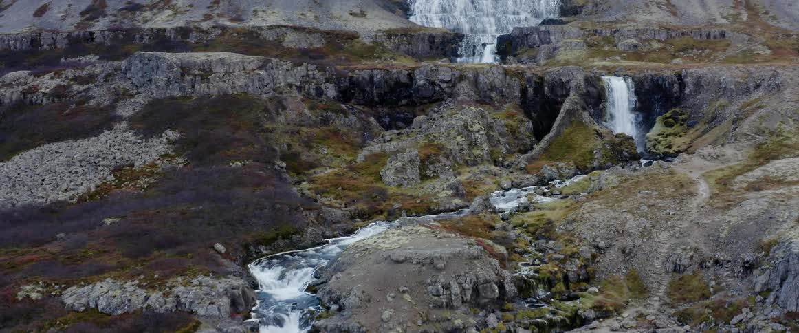 A waterfall and river running over rocks