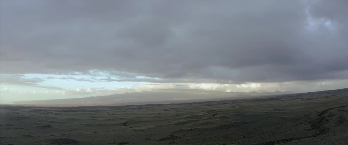 Clouds over flat land