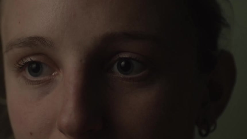 A young woman speaks animatedly