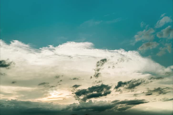 Clouds floating in the sky at sunset