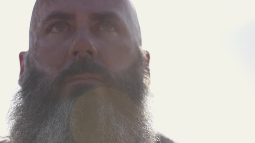 A man standing outside and looking up