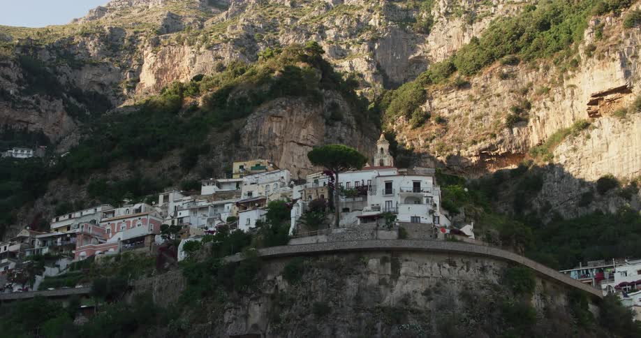 A beautiful old village is nestled up on the side of a mountain
