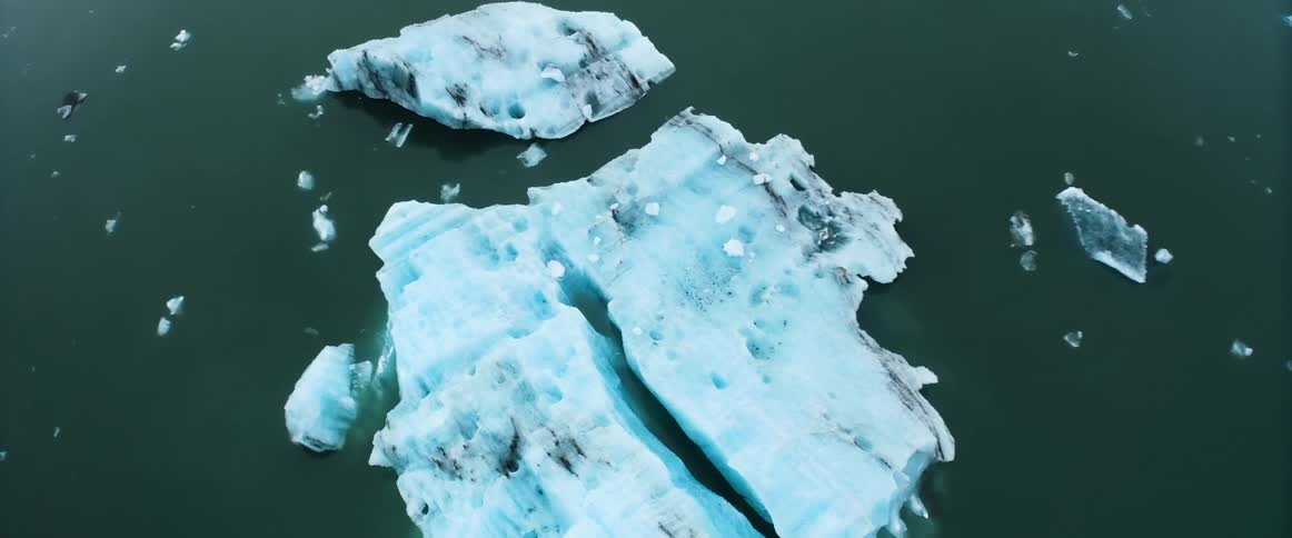 Aerial view of an iceberg floating on the surface of the ocean