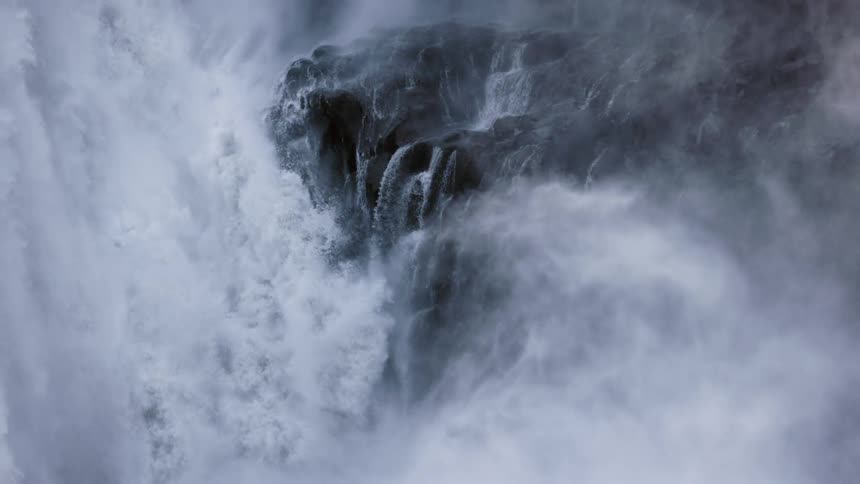 Mist rises from the waterfall