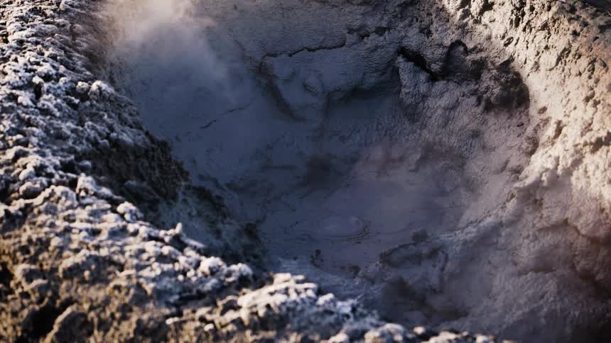Hot bubbling mud in a hot spring in winter